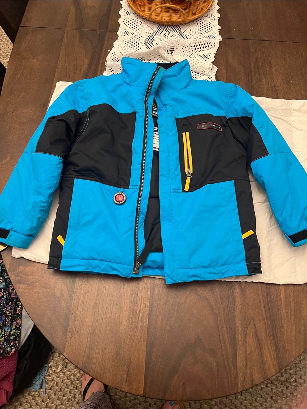 Obermeyer Bright Blue and Black Kids Puffer Jacket with Yellow Accents